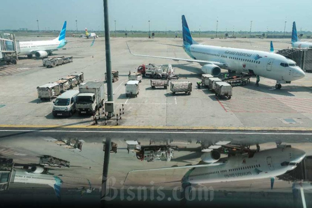 Pesawat milik maskapai penerbangan Garuda Indonesia terparkir di Bandara Internasional Soekarno-Hatta, Tangerang, Banten, Selasa (21/6/2022). Bisnis/Eusebio Chrysnamurti