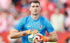 © Michael Reaves/Getty ImagesDominik Livakovic #1 of Croatia warms up before the FIFA World Cup 2026 Group L match